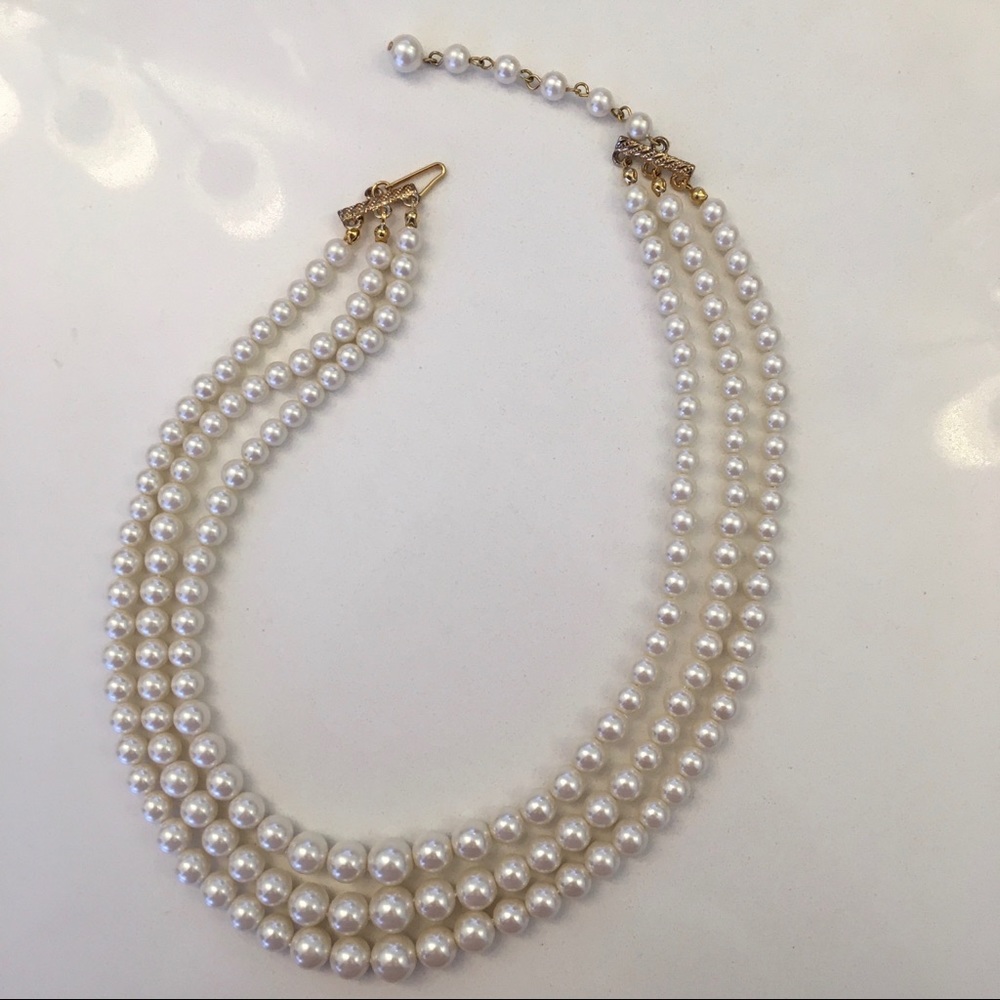 Triple stranded pearl necklace